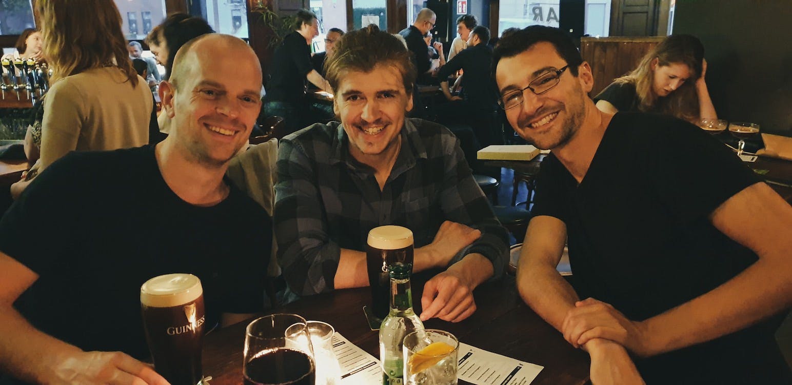 3 lads having a pint